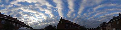 line shaped clouds over the Jan Baptist Huysmanslei in Hove, Belgium