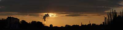 sunset seen from Merksem with the clouds of the Antwerp industry, Belgium